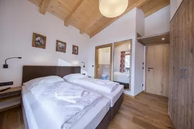 Ein Bett oder Betten in einem Zimmer der Unterkunft Nationalpark Chalet Rainerhorn