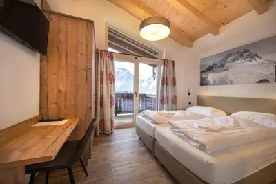 Ein Bett oder Betten in einem Zimmer der Unterkunft Nationalpark Chalet Lasörling
