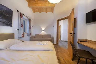 Ein Bett oder Betten in einem Zimmer der Unterkunft Nationalpark Chalet Lasörling
