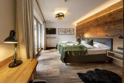 Ein Bett oder Betten in einem Zimmer der Unterkunft Nationalpark Chalet Bretterspitze