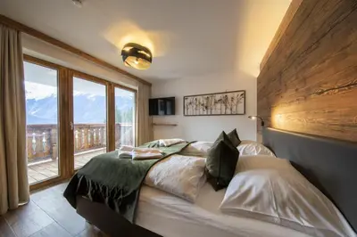 Ein Bett oder Betten in einem Zimmer der Unterkunft Nationalpark Chalet Bretterspitze