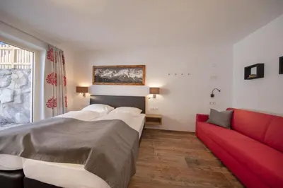 Ein Bett oder Betten in einem Zimmer der Unterkunft Nationalpark Chalet Stein am Ferner