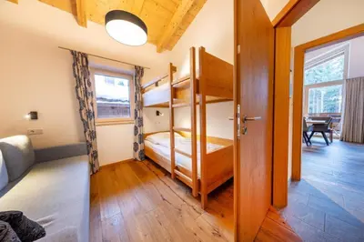 Ein Bett oder Betten in einem Zimmer der Unterkunft Nationalpark Chalet Achkogel