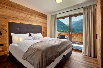Ein Bett oder Betten in einem Zimmer der Unterkunft Nationalpark Chalet Gamsspitze