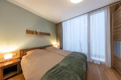 Ein Bett oder Betten in einem Zimmer der Unterkunft Residenz Wildkogelbahnen Top 3