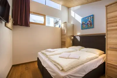 Ein Bett oder Betten in einem Zimmer der Unterkunft Residenz Wildkogelbahnen Top 11