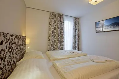 Ein Bett oder Betten in einem Zimmer der Unterkunft Residenz Wildkogelbahnen Top 19