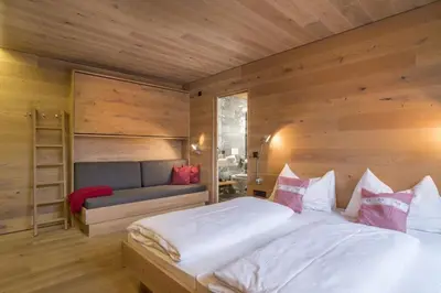 Ein Bett oder Betten in einem Zimmer der Unterkunft Smaragdresort Top 3.2 Happy Alps