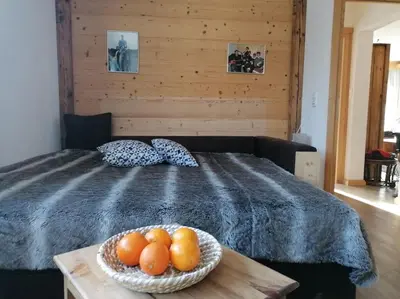 Ein Bett oder Betten in einem Zimmer der Unterkunft Wilder Kaiser Familien Ferienwohnung