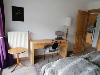 Ein Bett oder Betten in einem Zimmer der Unterkunft Wilder Kaiser Familien Ferienwohnung