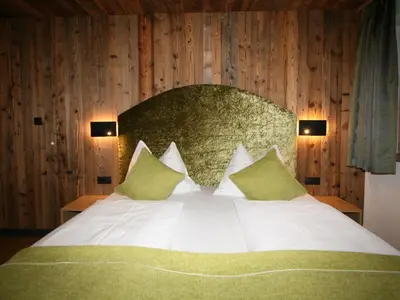 Ein Bett oder Betten in einem Zimmer der Unterkunft Apartment Erzherzog's Apts Kaiser und Alpenlodge by Interhome