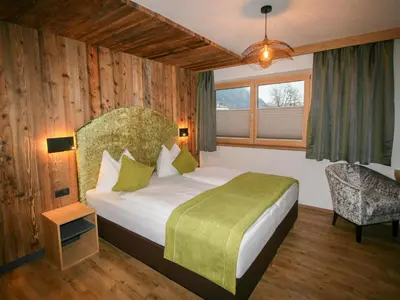 Ein Bett oder Betten in einem Zimmer der Unterkunft Apartment Erzherzog's Apts Kaiser und Alpenlodge by Interhome