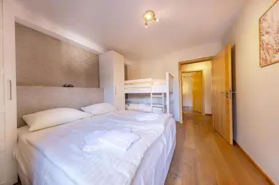 Ein Bett oder Betten in einem Zimmer der Unterkunft Residenz Sonnenfeld Top 5A