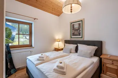 Ein Bett oder Betten in einem Zimmer der Unterkunft Hannes Appartement in im Zentrum von Kirchberg - by NV-Appartements