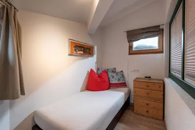 Ein Bett oder Betten in einem Zimmer der Unterkunft Hannes Appartement in im Zentrum von Kirchberg - by NV-Appartements