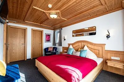 Ein Bett oder Betten in einem Zimmer der Unterkunft Das Dorfgefühl Pension Westendorf