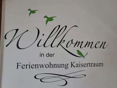 Ein Zertifikat, Auszeichnung, Logo oder anderes Dokument, das in der Unterkunft Ferienwohnung Kaisertraum ausgestellt ist