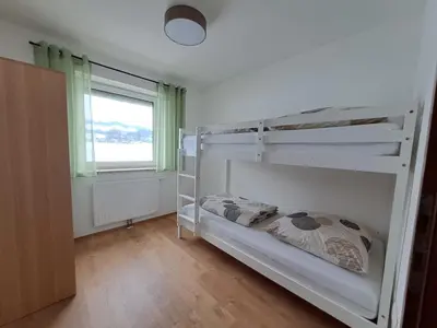 Ein Bett oder Betten in einem Zimmer der Unterkunft Ferienwohnung Kaisertraum