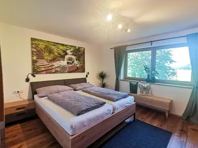 Ein Bett oder Betten in einem Zimmer der Unterkunft Ferienwohnung Haider