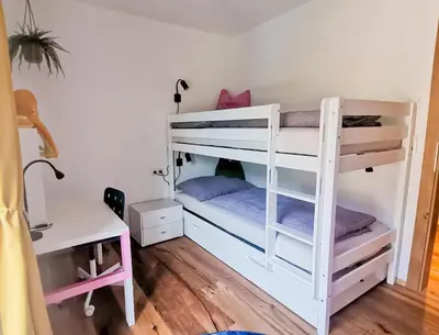 Ein Bett oder Betten in einem Zimmer der Unterkunft Ferienwohnung Haider