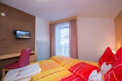 Ein Bett oder Betten in einem Zimmer der Unterkunft Landhaus Vier Jahreszeiten