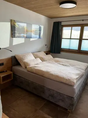 Ein Bett oder Betten in einem Zimmer der Unterkunft Ferienhäuser Schweitzer