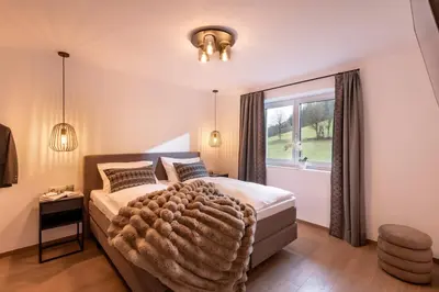 Ein Bett oder Betten in einem Zimmer der Unterkunft Appartement's Maroslhof