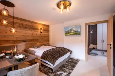 Ein Bett oder Betten in einem Zimmer der Unterkunft Appartement's Maroslhof