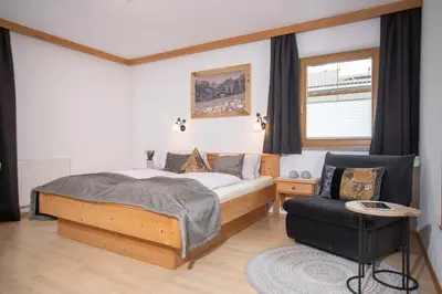 Ein Bett oder Betten in einem Zimmer der Unterkunft Ibex Apart