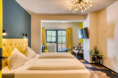 Ein Bett oder Betten in einem Zimmer der Unterkunft Boutique House happYellow Saalbach