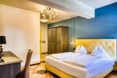 Ein Bett oder Betten in einem Zimmer der Unterkunft Boutique House happYellow Saalbach