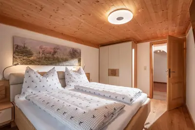 Ein Bett oder Betten in einem Zimmer der Unterkunft Chalet der Erzstadl