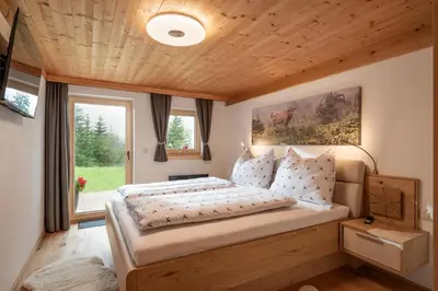 Ein Bett oder Betten in einem Zimmer der Unterkunft Chalet der Erzstadl