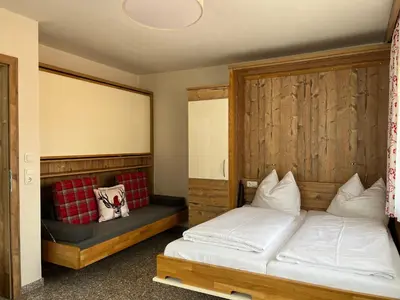 Ein Bett oder Betten in einem Zimmer der Unterkunft Boutique Apartment BERGLIEBE inklusive Joker Card Sommer