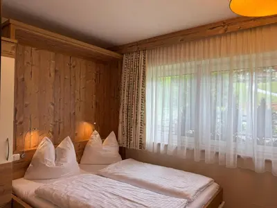 Ein Bett oder Betten in einem Zimmer der Unterkunft Boutique Apartment BERGLIEBE inklusive Joker Card Sommer