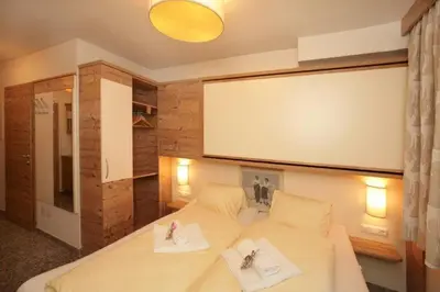 Ein Bett oder Betten in einem Zimmer der Unterkunft Boutique Apartment BERGLIEBE inklusive Joker Card Sommer
