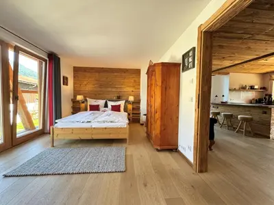 Ein Bett oder Betten in einem Zimmer der Unterkunft KitzCharme Penthouse by belle-stay