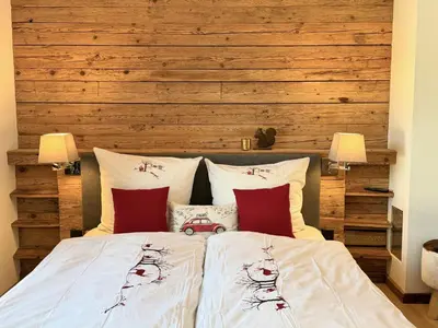 Ein Bett oder Betten in einem Zimmer der Unterkunft KitzCharme Penthouse by belle-stay