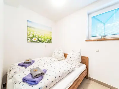 Ein Bett oder Betten in einem Zimmer der Unterkunft Apartment Evi by Interhome