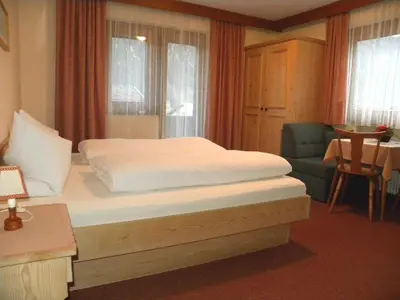 Ein Bett oder Betten in einem Zimmer der Unterkunft Gästehaus Emberger