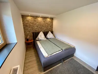Ein Bett oder Betten in einem Zimmer der Unterkunft Mountain Lodge