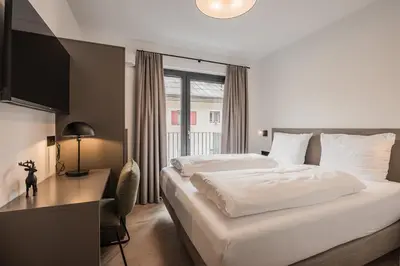 Ein Bett oder Betten in einem Zimmer der Unterkunft Gipfelglueck Family