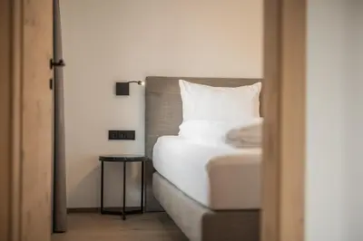 Ein Bett oder Betten in einem Zimmer der Unterkunft Gipfelglueck Family