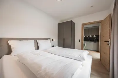 Ein Bett oder Betten in einem Zimmer der Unterkunft Gipfelglueck Family
