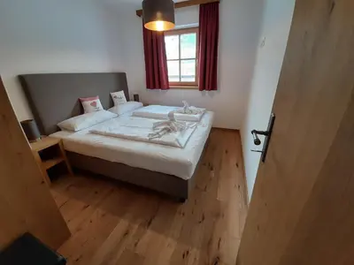Ein Bett oder Betten in einem Zimmer der Unterkunft Alpin Residenz Panoramabahn Kitzbühel