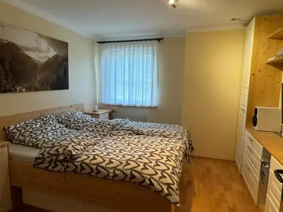 Ein Bett oder Betten in einem Zimmer der Unterkunft Chalet Alpine Royal A Top 1