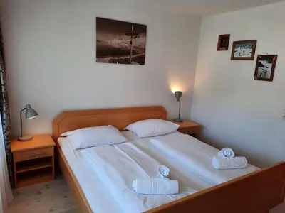 Ein Bett oder Betten in einem Zimmer der Unterkunft Sonnenalp Ski Juwel