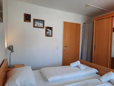 Ein Bett oder Betten in einem Zimmer der Unterkunft Sonnenalp Ski Juwel