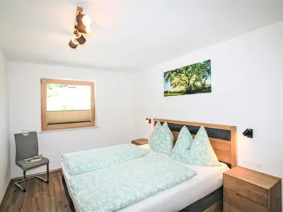 Ein Bett oder Betten in einem Zimmer der Unterkunft Apartment Vom Gerslosstein zum Rumerblick by Interhome