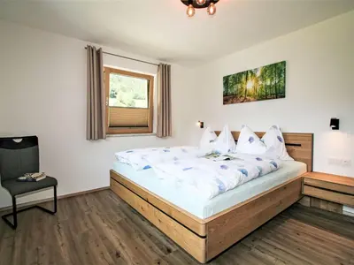 Ein Bett oder Betten in einem Zimmer der Unterkunft Apartment Gerlosstein Blick by Interhome